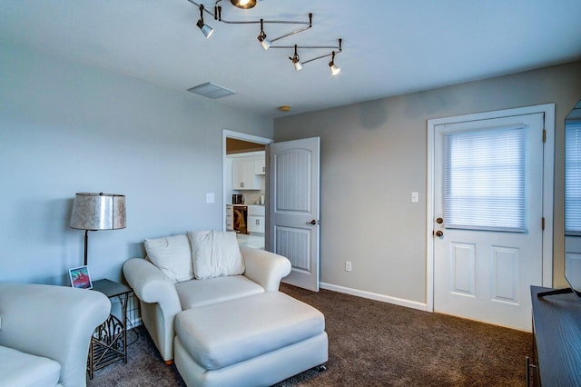 living room with visible vents, carpet flooring, and baseboards
