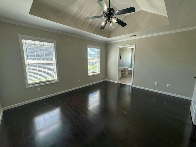 unfurnished room with crown molding, a ceiling fan, visible vents, and a raised ceiling