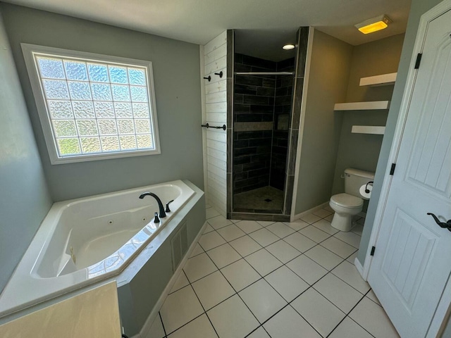 bathroom featuring toilet, a stall shower, a jetted tub, and tile patterned floors