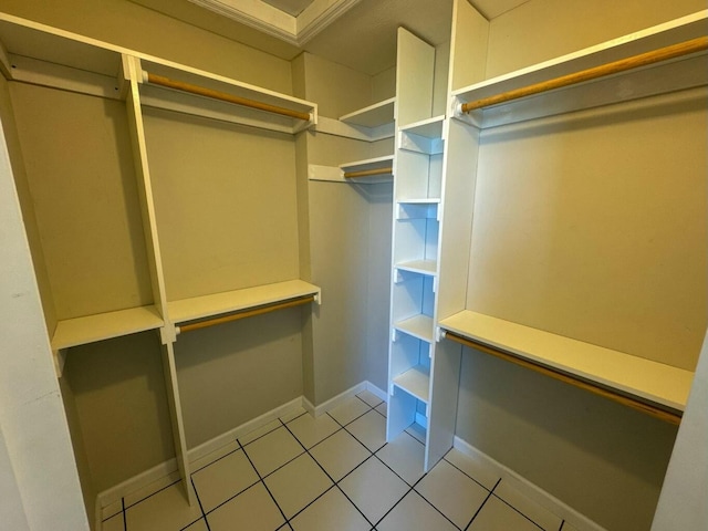 spacious closet with tile patterned floors