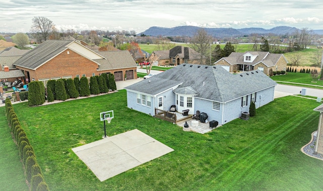 birds eye view of property with a mountain view and a residential view