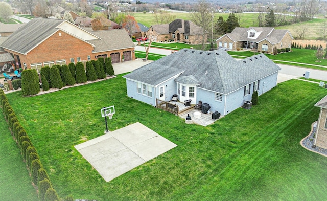birds eye view of property with a residential view