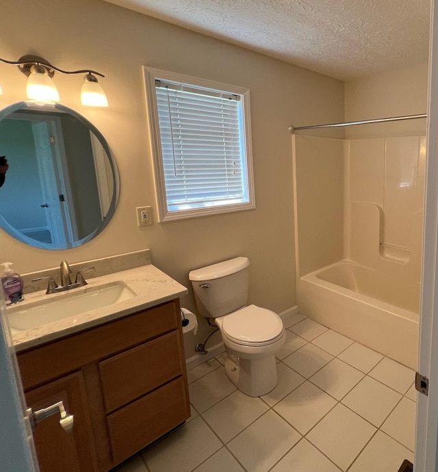bathroom featuring a textured ceiling, tile patterned flooring, vanity, toilet, and tub / shower combination