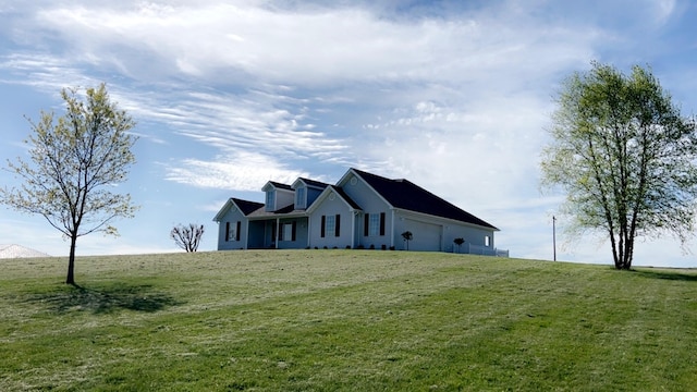 view of home's exterior with an attached garage and a yard