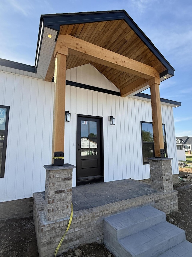 entrance to property featuring board and batten siding