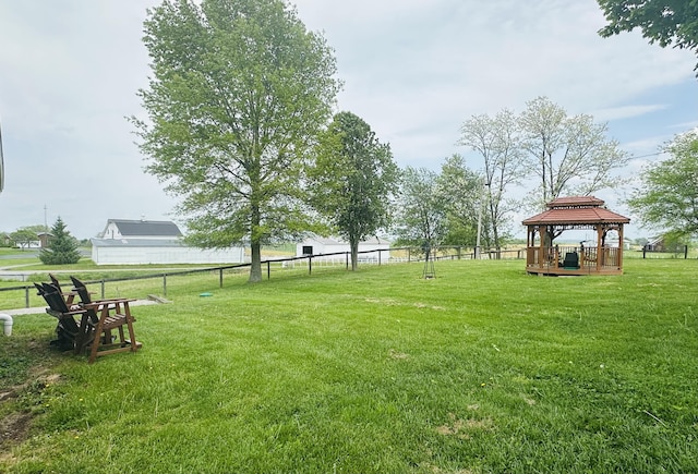 view of yard featuring a gazebo and fence