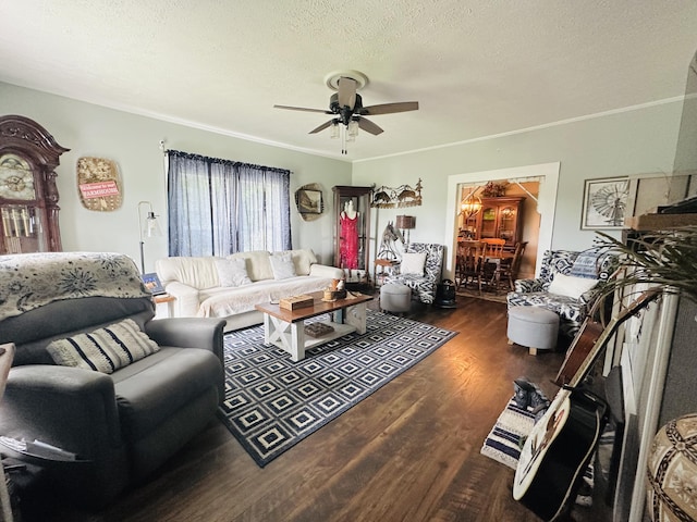 living room featuring crown molding, a ceiling fan, a textured ceiling, and dark wood finished floors