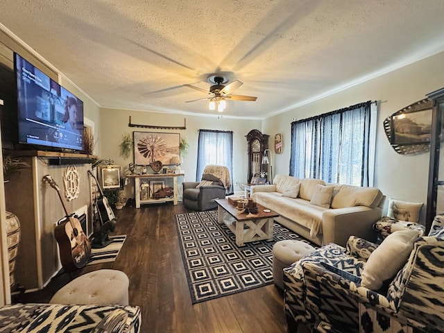 living area with a ceiling fan, a textured ceiling, wood finished floors, and ornamental molding