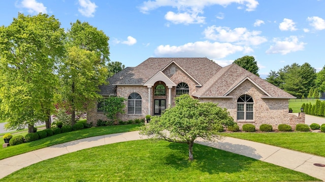 204 Helmsley Ln, Versailles, KY 40383 - french country home with brick siding and a front lawn