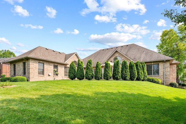 204 Helmsley Ln, Versailles, KY 40383 - view of front of property with brick siding, a front lawn, and roof with shingles