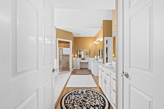 204 Helmsley Ln, Versailles, KY 40383 - full bath featuring a stall shower, two vanities, and wood finished floors