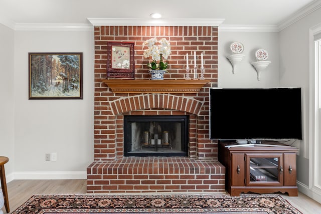 unfurnished living room featuring ornamental molding, a fireplace, and light wood finished floors