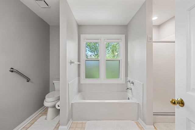 bathroom featuring a garden tub, visible vents, toilet, baseboards, and a shower stall
