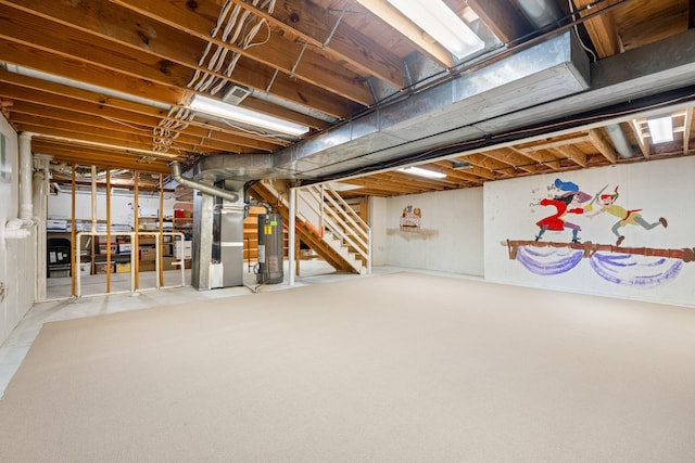 unfinished below grade area featuring heating unit, water heater, and stairway