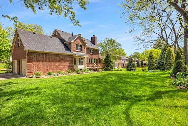exterior space with a chimney, an attached garage, a front lawn, and brick siding