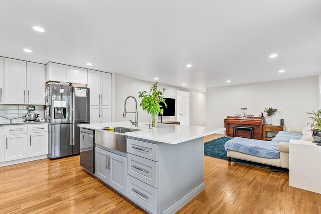 1144 Crenshaw Ln, Nicholasville, KY 40356 - kitchen with a sink, stainless steel appliances, recessed lighting, and light wood-style floors