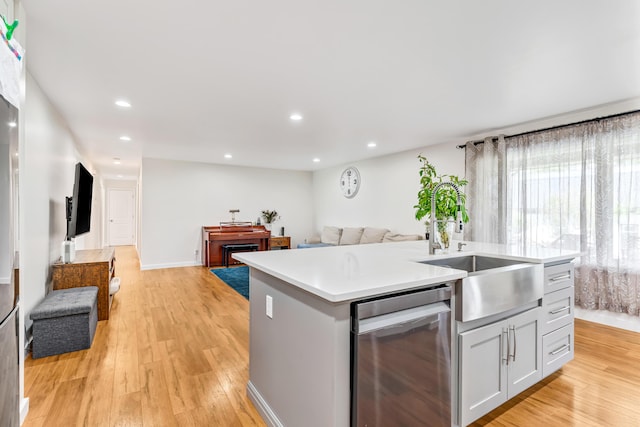 1144 Crenshaw Ln, Nicholasville, KY 40356 - kitchen with light wood-style flooring, stainless steel dishwasher, a sink, open floor plan, and a kitchen island with sink