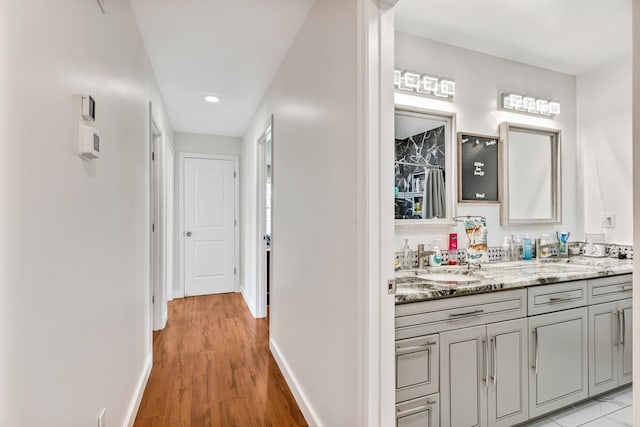 1144 Crenshaw Ln, Nicholasville, KY 40356 - hallway with a sink, recessed lighting, baseboards, and light wood-style floors