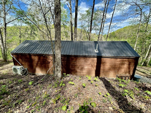 411 Alum Cave Rd, Annville, KY 40402 - exterior space with metal roof, a view of trees, and ac unit