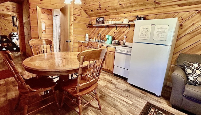411 Alum Cave Rd, Annville, KY 40402 - kitchen with wooden walls, light wood-type flooring, open shelves, and white appliances