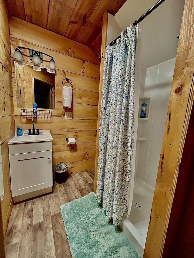 411 Alum Cave Rd, Annville, KY 40402 - full bath with wood finished floors, wood ceiling, a shower stall, wood walls, and vanity