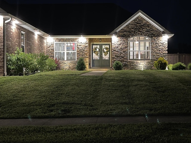 1500 Chardonnay Way, Berea, KY 40403 - view of front of house featuring stone siding, a lawn, and french doors