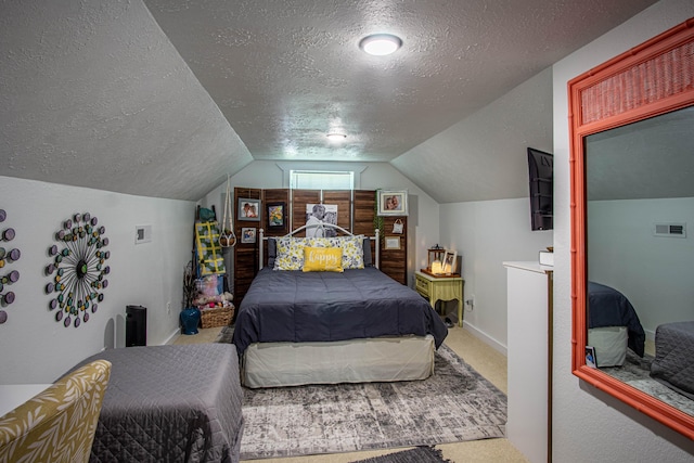 bedroom featuring carpet floors, a textured ceiling, vaulted ceiling, and baseboards
