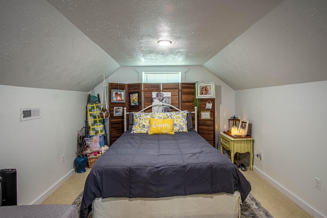 carpeted bedroom with visible vents, a textured ceiling, baseboards, and vaulted ceiling