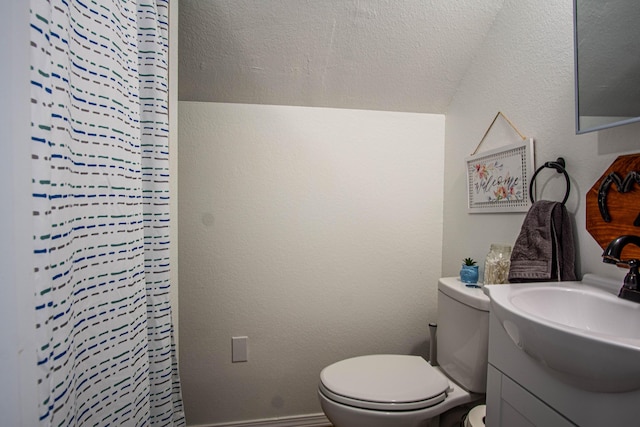 bathroom with vanity, toilet, and a shower with curtain