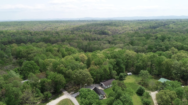 birds eye view of property with a wooded view