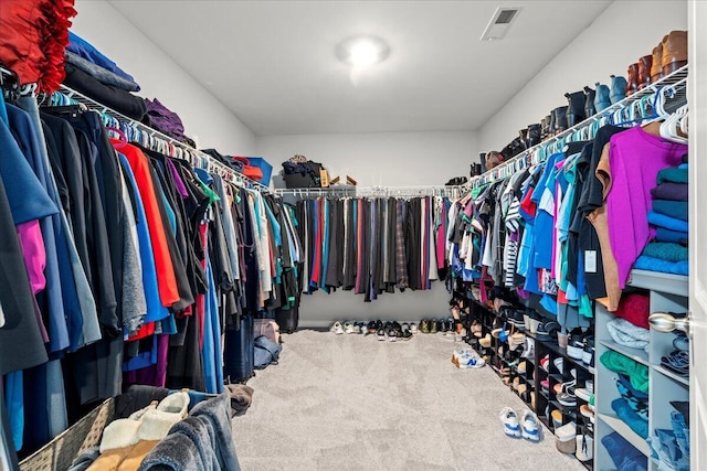 spacious closet with visible vents and carpet