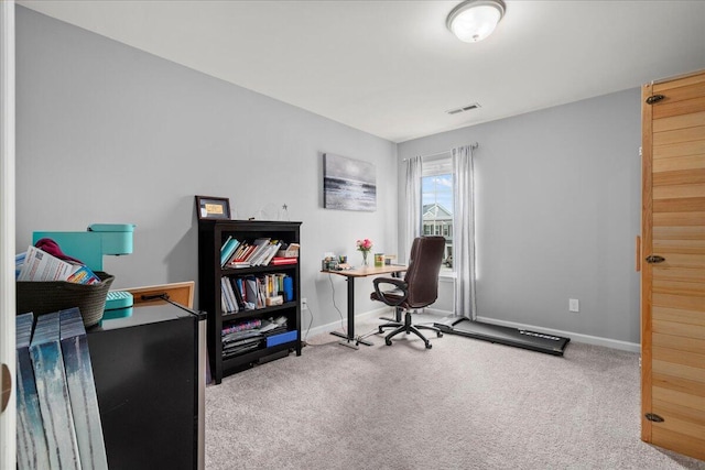 office featuring carpet flooring, baseboards, and visible vents