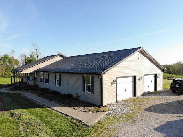 view of home's exterior with a yard and metal roof