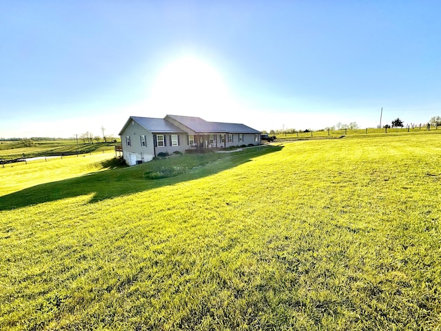 view of yard with a rural view