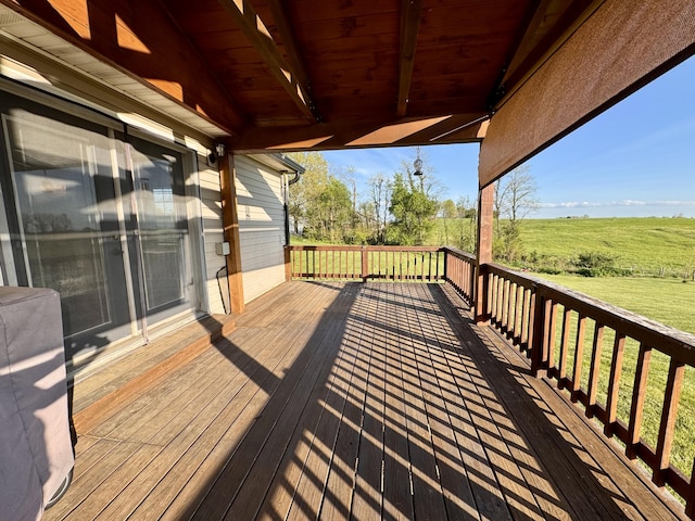 wooden deck with a rural view