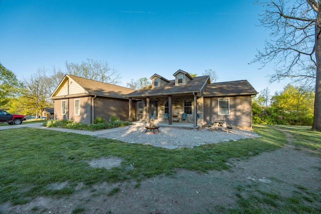 view of front of house featuring a porch and a front yard