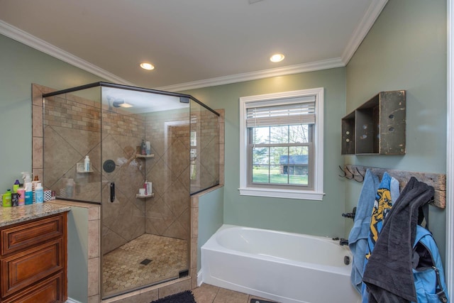 bathroom with recessed lighting, ornamental molding, a bath, and a stall shower
