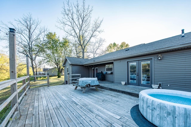 wooden deck featuring french doors