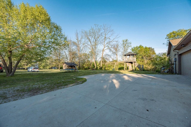 view of patio with concrete driveway