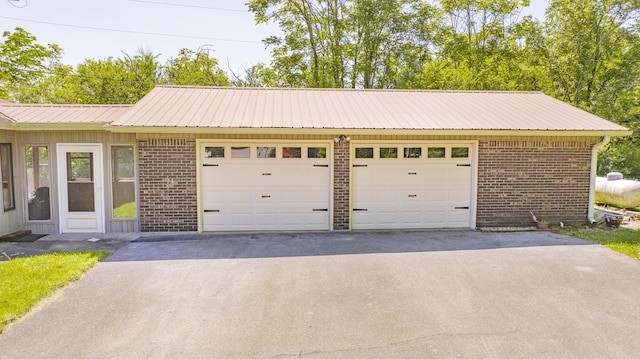 garage featuring driveway