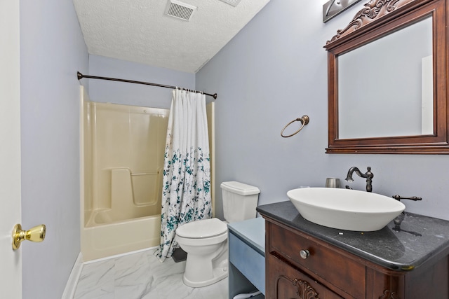 bathroom featuring visible vents, vanity, marble finish floor, toilet, and a textured ceiling