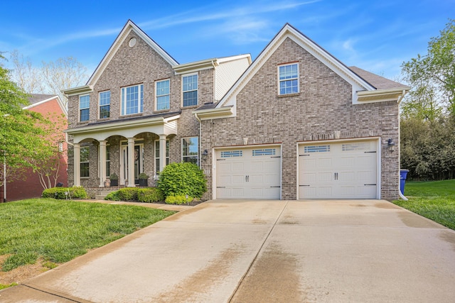 823 Lochmere Pl, Lexington, KY 40509 - view of front of home with brick siding, driveway, a front lawn, a porch, and a garage