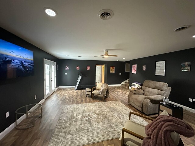 cinema room featuring visible vents, recessed lighting, a ceiling fan, and wood finished floors