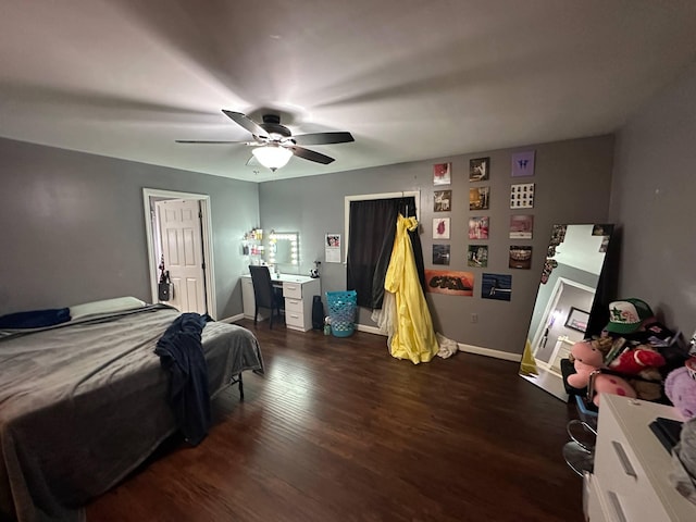 bedroom with baseboards, a ceiling fan, and dark wood-style floors