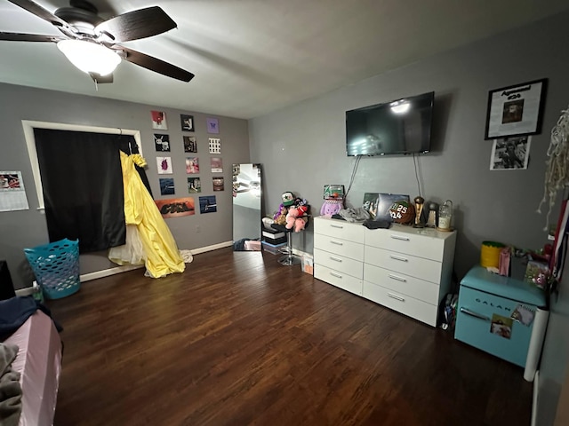 playroom featuring baseboards, ceiling fan, and wood finished floors