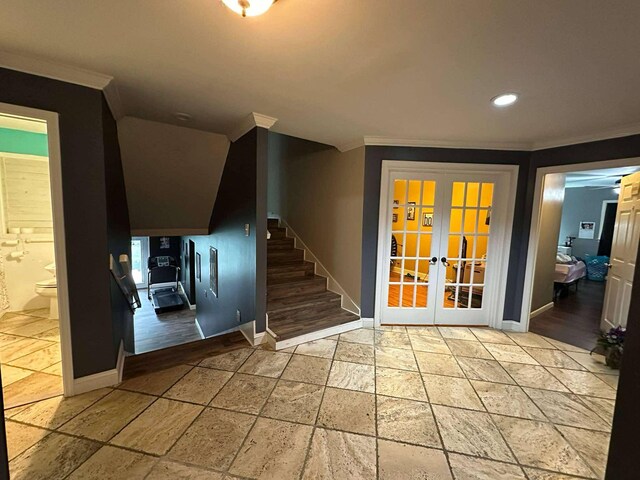 interior space featuring stone tile floors, ornamental molding, baseboards, recessed lighting, and french doors