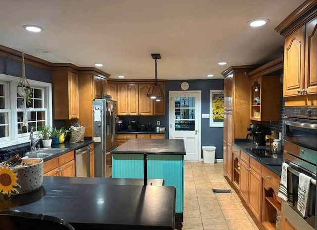 kitchen featuring stainless steel appliances, dark countertops, recessed lighting, and light tile patterned floors