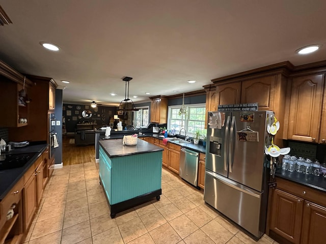kitchen with recessed lighting, dark countertops, and appliances with stainless steel finishes