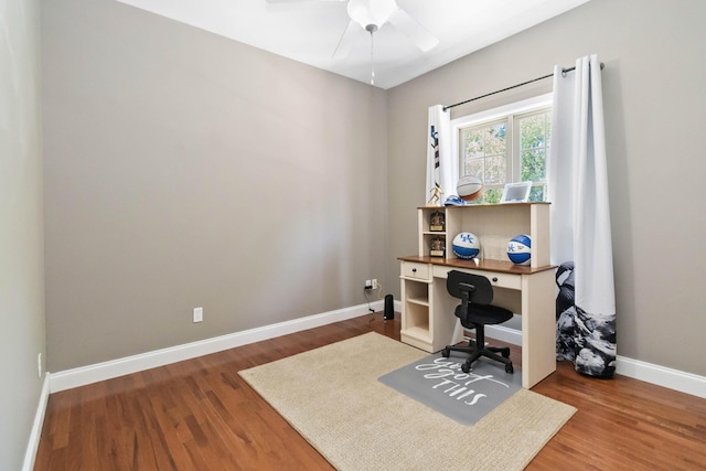 office with a ceiling fan, baseboards, and wood finished floors