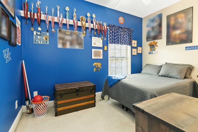 bedroom with baseboards, ceiling fan, and carpet